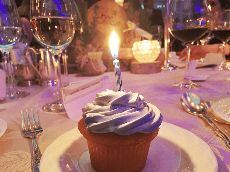 Cupcakes with a single candle were given to guests to represent every baby's first birthday.