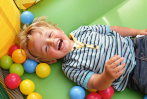 Happy Kid in bouncy house